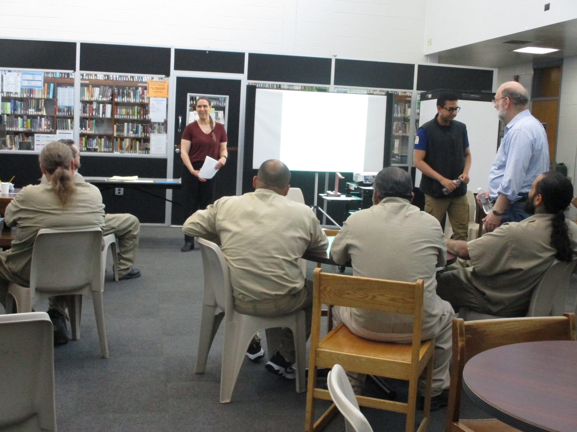 Faculty leading a conversation with the inmates